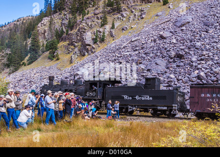 Photographers shooting runby of photo train with 1925 Baldwin 2-8-2 steam locomotive and mixed consist train at Needle Creek. Stock Photo