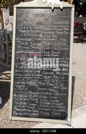 menu of street restaurant written with chalk on big black board Stock Photo