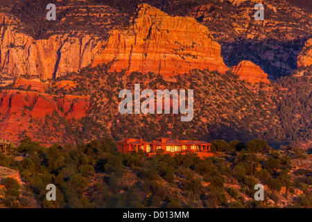 Sunset is very dramatic on the red rock hills surrounding Sedona, Arizona. Stock Photo