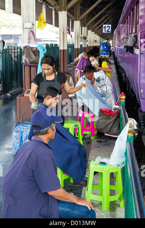 Cutting Hairs on a Platform of the Central Railway Station in Bangkok, Thailand Stock Photo