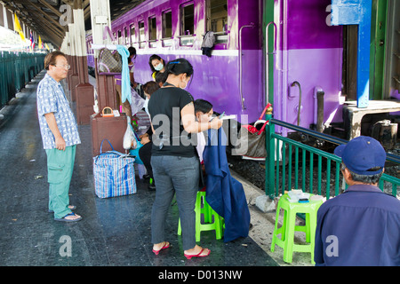 Cutting Hairs on a Platform of the Central Railway Station in Bangkok, Thailand Stock Photo