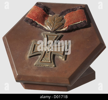 Karl-Friedrich Merten - Knight's Cross and Oak Leaves of the Iron Cross of 1939,made from on-board materials. Knight's Cross and Oak Leaves tidily constructed in copper with a short ribbon section of black,red and white flag cloth. Mounted on a hexagonal Bakelite panel with support mount,historic,historical,1930s,1930s,20th century,navy,naval forces,military,militaria,branch of service,branches of service,armed forces,armed service,object,objects,stills,clipping,clippings,cut out,cut-out,cut-outs,fine arts,art,art object,art objects,,Additional-Rights-Clearences-Not Available Stock Photo