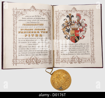 A patent of nobility,for Franz Ritter von Pitha,granting the title of Freiherr(baron). Document on vellum with calligraphic text and rich illustrations,including a polychrome coat of arms,the last page with the date 1875,and the signatures of Emperor Franz-Joseph and Freiherr von Laßner-Zollheim. Purple velvet cover with a heraldic eagle applied in gold. Attached gilt seal-box,the lid bearing the Imperial arms in relief. With tin-plated sheet iron case,31 x 53 cm,hinge open. Document in very good condition,historic,historical,19th century,Imperial,,Additional-Rights-Clearences-Not Available Stock Photo