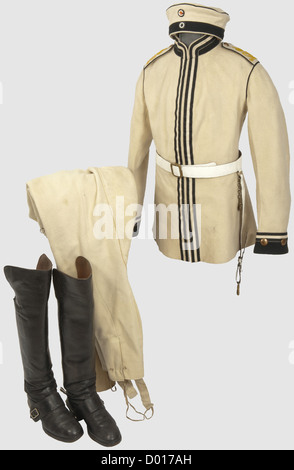 A uniform ensemble,of a Corporal in the Life Cuirassier Regiment Nr.1.Tunic with black borders and piping,the shoulder boards with embroidered regimental cipher.The liner bears an arsenal stamp for the 2nd Squadron,unconspicuous moth traces on the outer surfaces.Cavalry breeches with inset chamois riding leather and an obliterated arsenal stamp of the Garde du Corps.White cloth 'Krätzchen'(field cap)with enlisted men's cockades,without moth damage.White painted belt with sabre suspension.A pair of cuirassier boots with high shafts,buckle-on spurs,,Additional-Rights-Clearences-Not Available Stock Photo