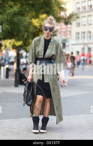 Street style image of girl in avant guard kimono sunglasses outfit wearing Damir Doma and a vintage kimono Stock Photo