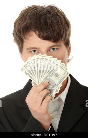 Young handsome man holding dollars over white isolated background ...