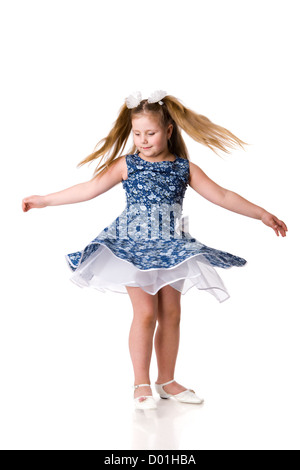 Cheerful girl spinning on floor isolated on white Stock Photo