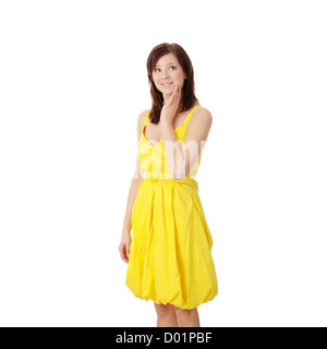 Beautiful brunette girl in yellow dress. Stock Photo