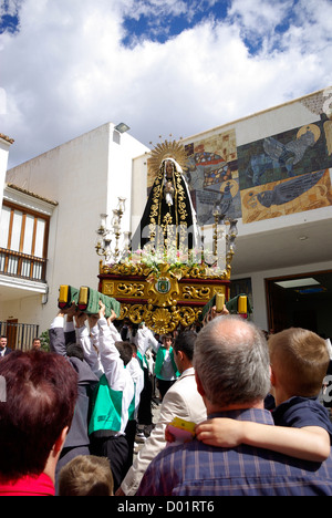 Easter Sunday procession during Semana Santa in Calpe, Spain. An effigy of the virgin Mary is hoisted into the church Stock Photo