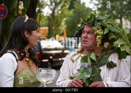 Herbert Graedtke as 'Bacchus' with wine queen  at Radebeul Herbst und Weinfest, Sachsen, Saxony, Germany Stock Photo