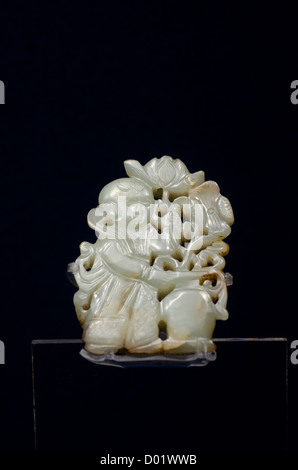 China, Shanghai, Shanghai Museum. Ancient jade collection. Jade boy holding a lotus flower, c. Song (960-1279 AD) Stock Photo