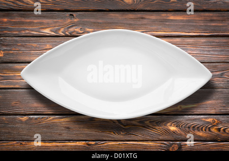 Dishes for fish on a brown wooden table Stock Photo