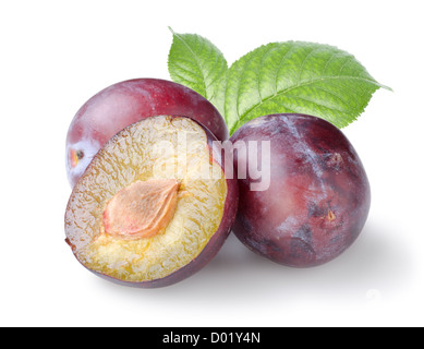 Three plums with leaves isolated on a white background Stock Photo