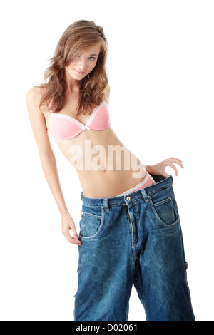 Woman showing how much weight she lost. Stock Photo