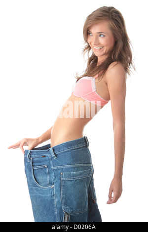 Woman showing how much weight she lost. Stock Photo