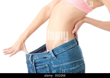 Woman showing how much weight she lost. Stock Photo