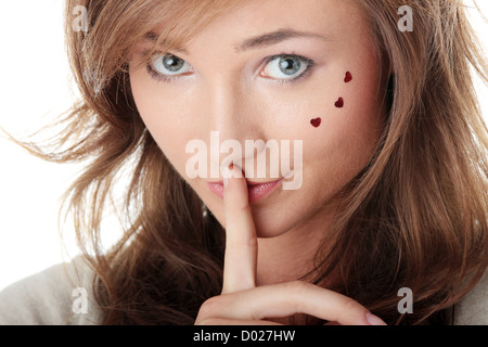 Young Woman Gesturing for Quiet or Shushing Stock Photo