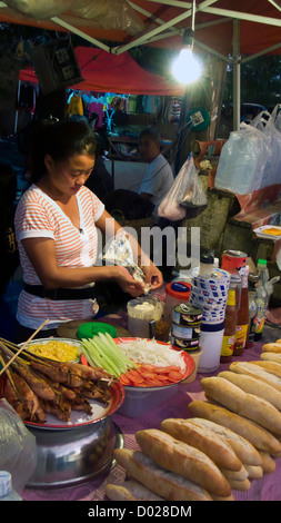 Food stall with baguette sandwiches Luang Prabang night market Laos Stock Photo