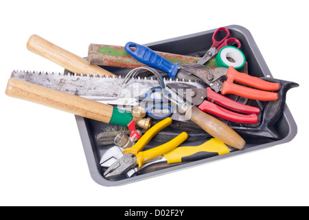 Old rusty used garden tools in metal box isolated. Slective focus Stock Photo