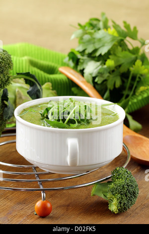 Cream soup  broccoli with arugula greens in a white bowl Stock Photo