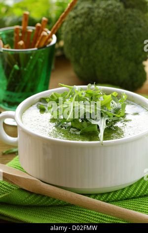 Cream soup  broccoli with arugula greens in a white bowl Stock Photo