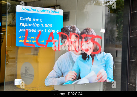 Bank's office (Caixabank) with a tag: thieves, in general strike 14 novembre 2012 in Barcelona Stock Photo