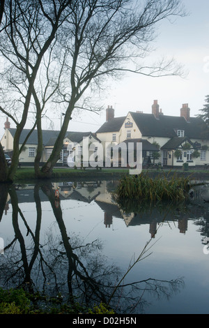 The Rose Inn, Baxterley, a public house in North Warwickshire which has a duck pond in front of it. Stock Photo