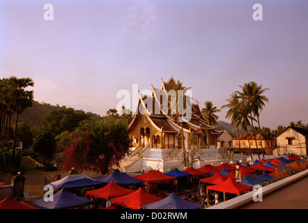 The beautiful Buddhist Wat Mai Suwannaphumaham Temple in Luang Prabang in Laos in Indochina in Far East Southeast Asia. Buddhism Architecture Travel Stock Photo