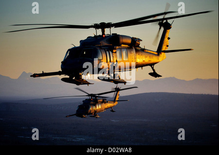 The US Air Force HH-60 Pave Hawk flies at sunset January 19, 2012. Stock Photo