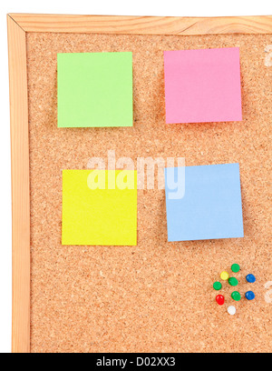 Photo of corkboard with a four colour post-it Stock Photo