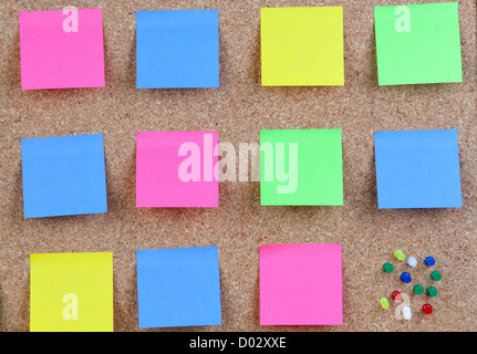 Photo of corkboard with many colour post-it Stock Photo