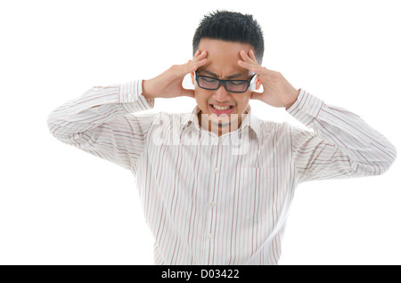 asian business male having a bad headache Stock Photo