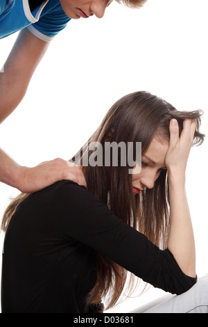Troubled young girl comforted by her boyfriend Stock Photo - Alamy
