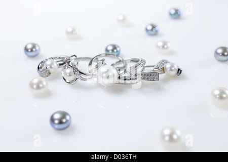 Rings and earrings with pearls Stock Photo