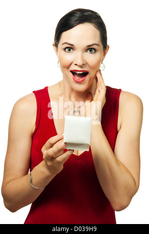 Surprised beautiful woman holding jewellery gift box Stock Photo