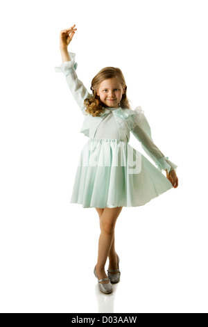 Cheerful girl spinning on floor isolated on white Stock Photo