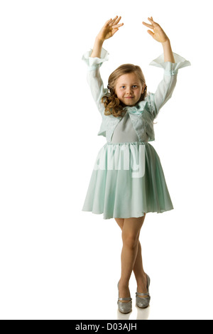 Cheerful girl spinning on floor isolated on white Stock Photo