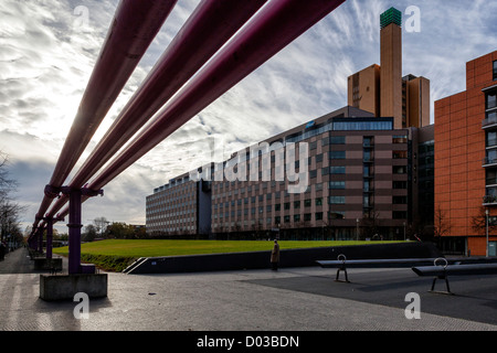 Tilla Durieux Park, giant  large see-saws and modern buildings at Potsdamerplatz, Berlin.The giant pink drainage pipes drain water from Construction Stock Photo