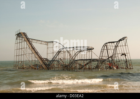 The historic roller coaster that has been on the boardwalk for 70-years sits in the Atlantic Ocean after Hurricane Sandy November 12, 2012 in Seaside Heights, NJ. Stock Photo
