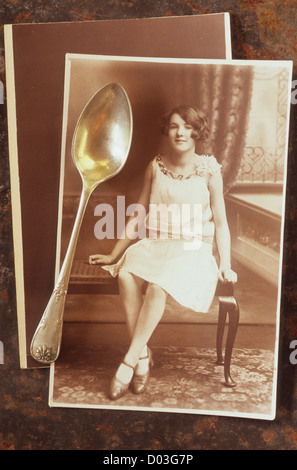 Sepia photo of 1920s young woman on bench in photo studio and teaspoon lying on print Stock Photo