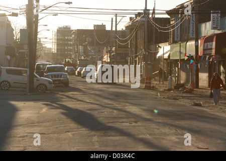 Street Damage, Shadows, Rockaway Beach Blvd, Queens, NY Stock Photo