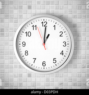 Simple clock or watch on white tile wall displaying one o'clock Stock Photo