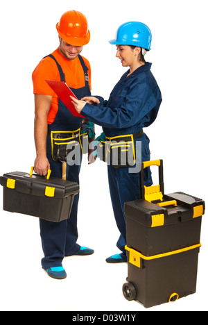 Two builders workers having discussion and looking in a clipboard isolated on white background Stock Photo