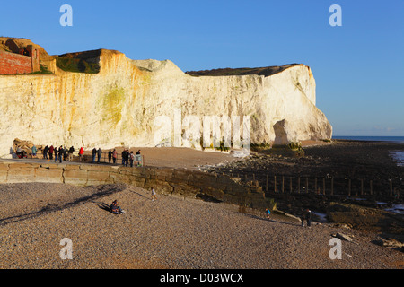 People looking at the chalk cliffs of Seaford Head East Sussex UK GB Stock Photo