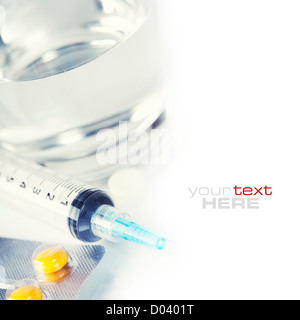 Glass of Water, Syringe and Pills (with sample text) Stock Photo
