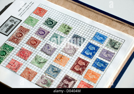 Close up of page of British stamps in stamp collection collecting album England UK United Kingdom GB Great Britain Stock Photo