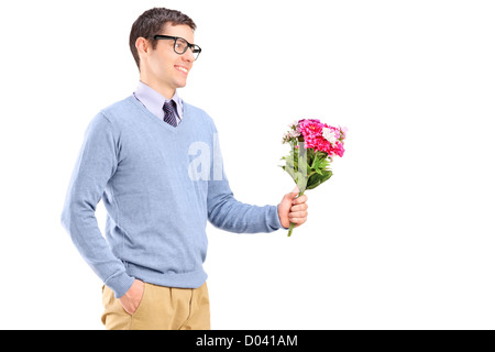 A young man holding flowers isolated on white background Stock Photo