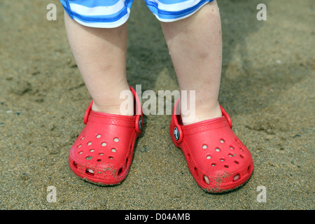 baby wearing crocs