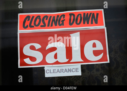 Closing Down Sign in Shop Window. Stock Photo