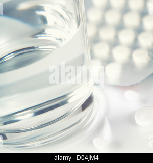 Glass of Water and Pills Stock Photo